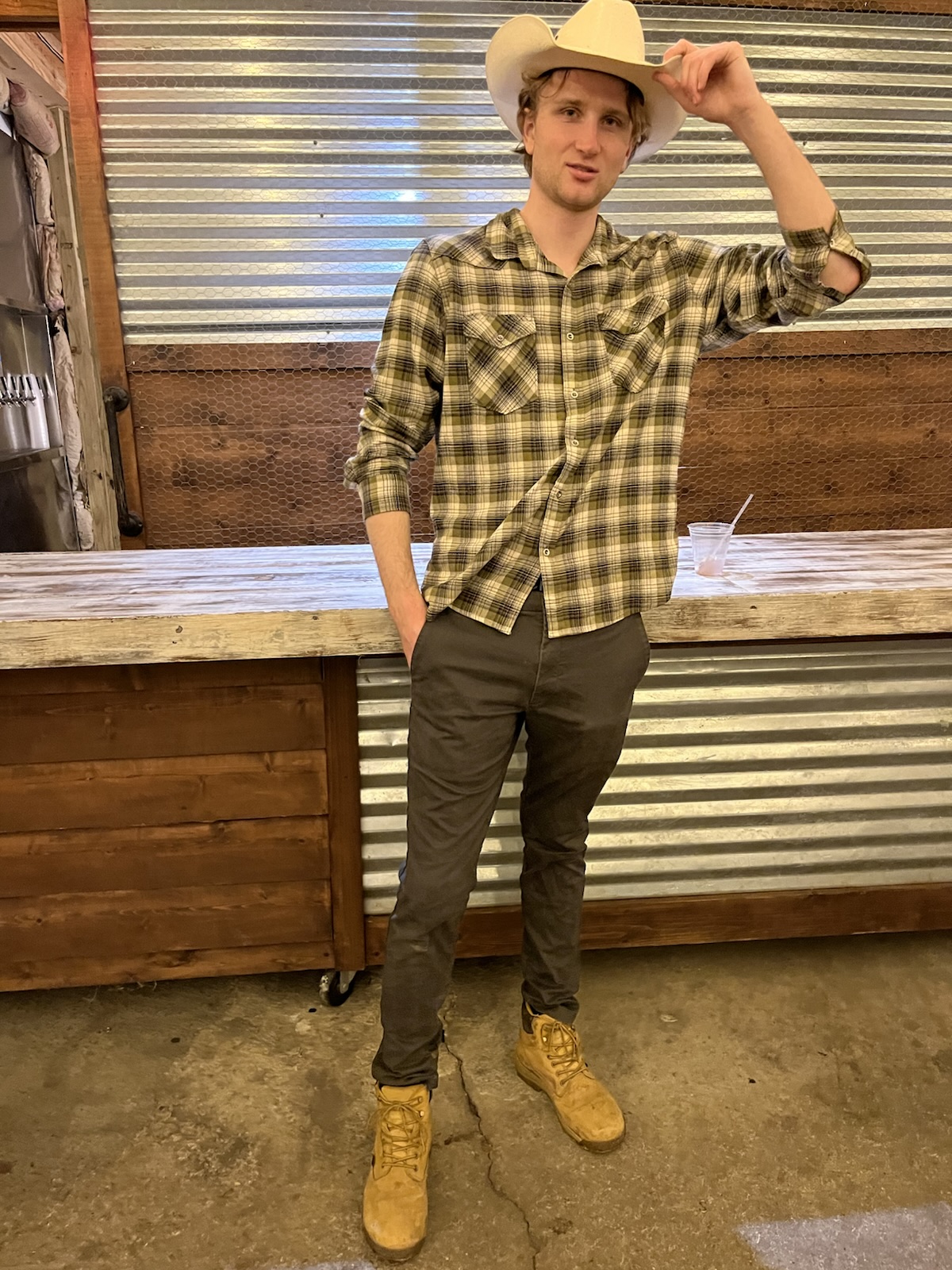 Lex Wellington in a cowboy hat and flannel